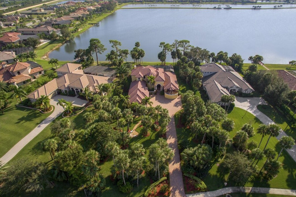 aerial view of rooftops in front of a lake