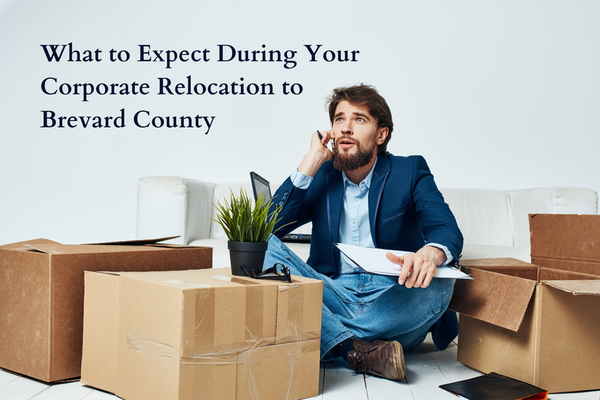 man surrounded by boxes talking on cellphone