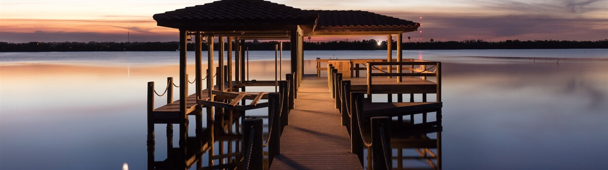 sunset over Honeymoon Lake dock Merritt Island, Florida