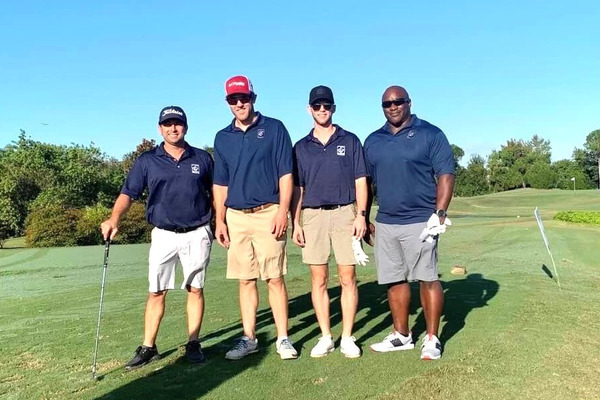 Ellingson Properties' Jason Solano and golf teammates