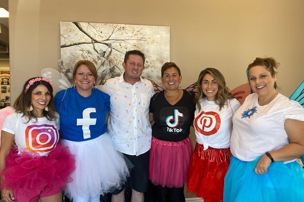 Ellingson Properties team members dressed as social butterflies