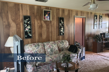 Dark wood paneling, dated ceiling fan and mauve shag carpet did nothing for this living area of the home.