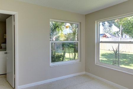 After image of dining space sports freshly painted walls, new baseboards as well as refinished Terrazzo 