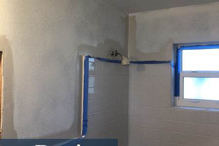 This image taken after wallpaper removal and texturing of a bathroom wall.