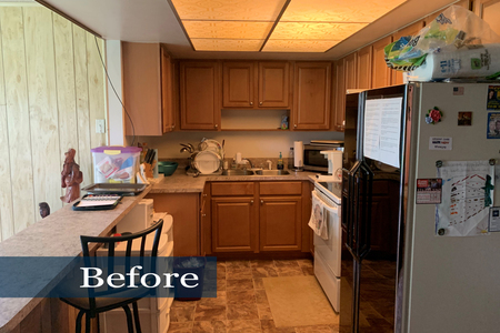 Original kitchen cabinetry and countertops were in good condition. However the ceiling lighting made the small space seem smaller.