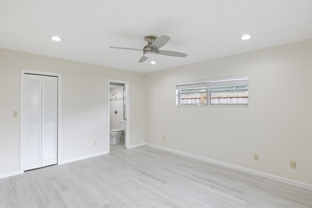 After - The addition of recessed lighting and a ceiling fan brings the room into the 20th Century