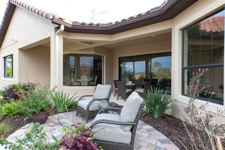 Just outside the master windows is a private paver patio separate from the lanai