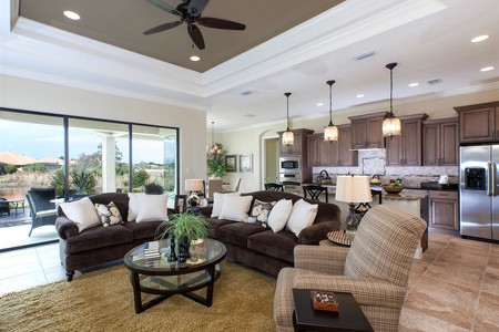 Great room floor plan with triple sliding glass doors that open to the lanai