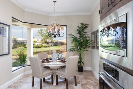 Butted glass windows frame views of nature in the breakfast nook.  Perfect for informal dining.