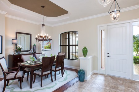 Formal dining room is located adjacent the foyer