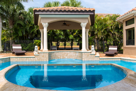 The pergola is on a two step elevation from the pool deck making it a perfect place to relax while watching the young ones in the pool