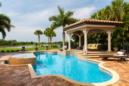 View of Pergola and pool as seen from residence living room & foyer