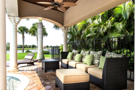 Gorgeous ceiling detail and fan envelope the pergola in elegance. 