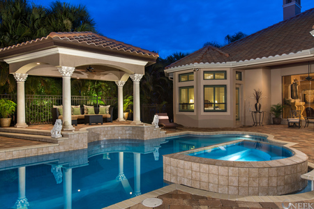 Evening shot of 10'x15' pergola shows structure matches roof line of main home.  