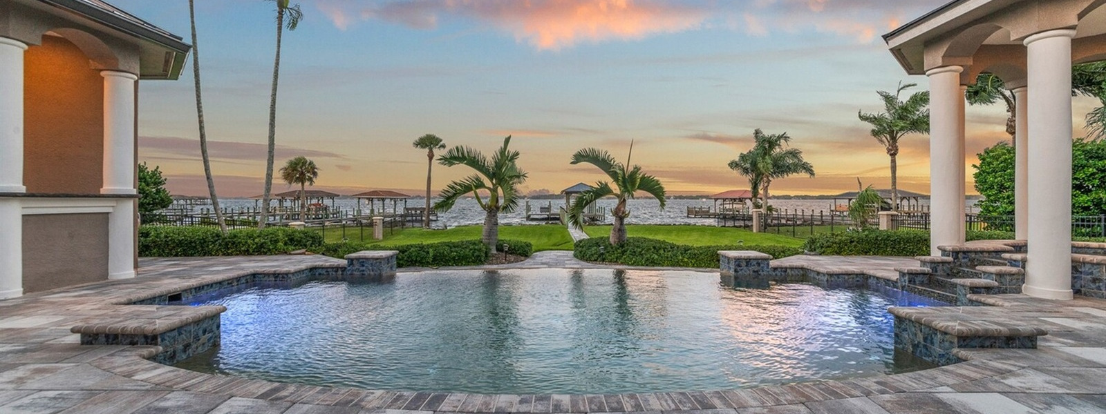 pool and cabana overlooking the river and private dock